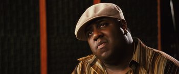 Movie still from “Notorious” (2009), directed by George Tillman Jr. – A person wearing a hat; Close Up shot, Low angle