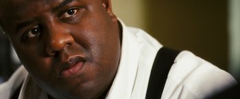 Movie still from “Notorious” (2009), directed by George Tillman Jr. – A person wearing a white shirt; Extreme Close Up shot, Low angle