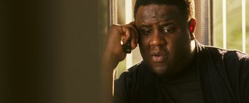 Movie still from “Notorious” (2009), directed by George Tillman Jr. – A person talking on a cell phone; Close Up shot, Low angle