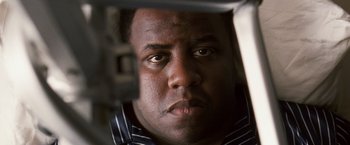 Movie still from “Notorious” (2009), directed by George Tillman Jr. – A man's face looking into a mirror; Close Up shot, Low angle
