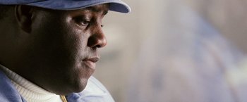 Movie still from “Notorious” (2009), directed by George Tillman Jr. – A person wearing a hat; Close Up shot, Low angle