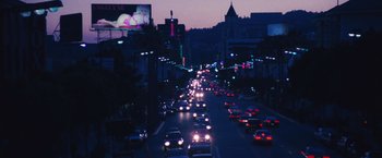 Movie still from “Notorious” (2009), directed by George Tillman Jr. – A city street filled with lots of traffic at night; Extreme Wide shot, High angle