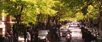 Movie still from “Notorious” (2009), directed by George Tillman Jr. – A police officer on a horse in the middle of the street; Wide shot, High angle