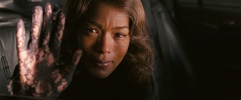 Movie still from “Notorious” (2009), directed by George Tillman Jr. – A woman's face with tears coming out of her eyes; Close Up shot, Overhead angle