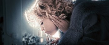 Movie still from “Notorious” (2009), directed by George Tillman Jr. – A person drinking from a glass; Extreme Close Up shot, Low angle