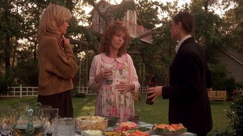 Movie still from “Now and Then” (1995), directed by Lesli Linka Glatter – A group of people standing around a table with food; Wide shot, Low angle