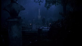 Movie still from “Now and Then” (1995), directed by Lesli Linka Glatter – Two people are standing in a graveyard at night; Wide shot, Low angle