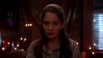 Movie still from “Now and Then” (1995), directed by Lesli Linka Glatter – A young woman with long hair and a striped shirt; Close Up shot, High angle