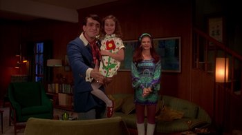 Movie still from “Now and Then” (1995), directed by Lesli Linka Glatter – A man and a woman and a little girl dressed up in costumes; Medium shot, Low angle