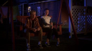 Movie still from “Now and Then” (1995), directed by Lesli Linka Glatter – Two women sitting on a bench at night; Wide shot, Low angle