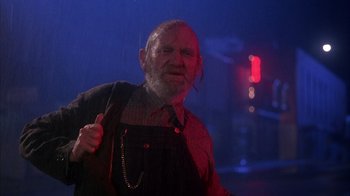 Movie still from “Now and Then” (1995), directed by Lesli Linka Glatter – An old man with a beard is standing in the dark; Medium shot, Low angle