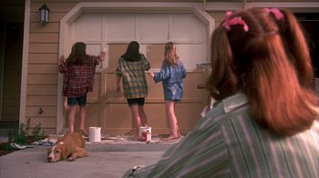 Movie still from “Now and Then” (1995), directed by Lesli Linka Glatter – A group of young women painting a garage door; Wide shot, Over the shoulder angle