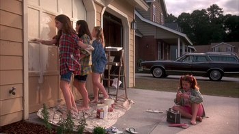 Movie still from “Now and Then” (1995), directed by Lesli Linka Glatter – A group of young girls standing on the side of a house; Wide shot, High angle