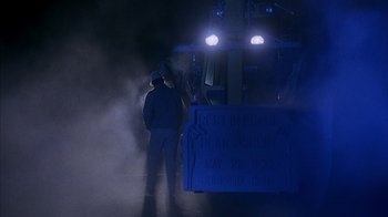 Movie still from “Now and Then” (1995), directed by Lesli Linka Glatter – A man standing in front of a train at night; Wide shot, Low angle