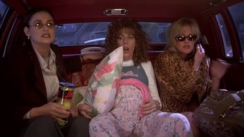 Movie still from “Now and Then” (1995), directed by Lesli Linka Glatter – A group of people sitting in a car; Medium shot, High angle