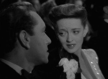 Movie still from “Now, Voyager” (1942), directed by Irving Rapper – A man and a woman talking to each other; Close Up shot, Over the shoulder angle