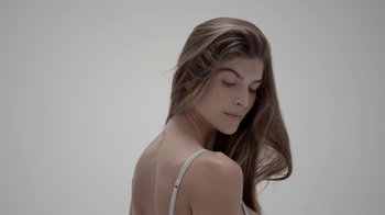 Movie still from “Nude” (2017), directed by Tony Sacco – A beautiful young woman with long , brown hair; Close Up shot, Low angle