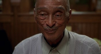 Movie still from “Nutty Professor II: The Klumps” (2000), directed by Peter Segal – An older man with a mustache and a mustache comb; Close Up shot, Low angle
