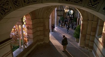 Movie still from “Nutty Professor II: The Klumps” (2000), directed by Peter Segal – A group of people walking down a sidewalk; Extreme Wide shot, High angle