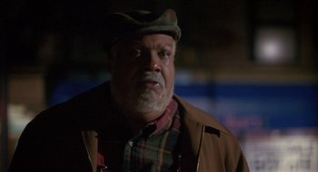 Movie still from “Nutty Professor II: The Klumps” (2000), directed by Peter Segal – An older man wearing a hat and a jacket; Close Up shot, Low angle