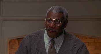 Movie still from “Nutty Professor II: The Klumps” (2000), directed by Peter Segal – An older man wearing glasses and a tie; Close Up shot, Low angle