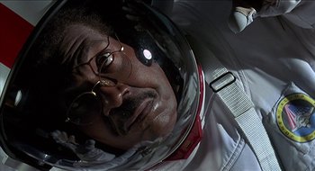 Movie still from “Nutty Professor II: The Klumps” (2000), directed by Peter Segal – A person wearing a helmet; Close Up shot, Low angle