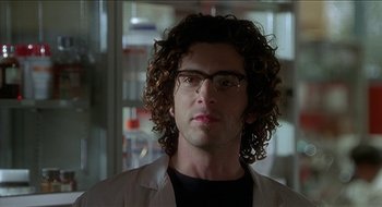 Movie still from “Nutty Professor II: The Klumps” (2000), directed by Peter Segal – A person wearing glasses and a lab coat; Close Up shot, Low angle