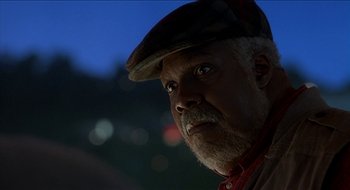 Movie still from “Nutty Professor II: The Klumps” (2000), directed by Peter Segal – An older man wearing a hat and looking into the distance; Close Up shot, Low angle