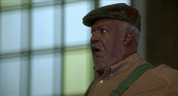 Movie still from “Nutty Professor II: The Klumps” (2000), directed by Peter Segal – An older man wearing a hat and looking surprised; Close Up shot, Low angle