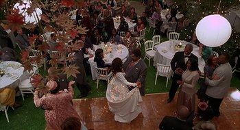 Movie still from “Nutty Professor II: The Klumps” (2000), directed by Peter Segal – A bride and groom are dancing at their wedding; Extreme Wide shot, High angle