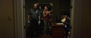 Movie still from “Oculus” (2013), directed by Mike Flanagan – A group of people standing in a room; Wide shot, Low angle