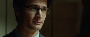 Movie still from “Oculus” (2013), directed by Mike Flanagan – A person wearing glasses; Close Up shot, Over the shoulder angle