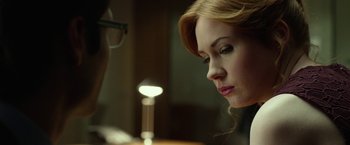 Movie still from “Oculus” (2013), directed by Mike Flanagan – A person looking down at a table; Close Up shot, Over the shoulder angle