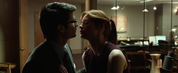 Movie still from “Oculus” (2013), directed by Mike Flanagan – A man and a woman are kissing in a room; Close Up shot, Low angle