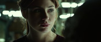 Movie still from “Oculus” (2013), directed by Mike Flanagan – A woman's face in the dark; Close Up shot, Over the shoulder angle