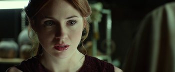 Movie still from “Oculus” (2013), directed by Mike Flanagan – A woman with red hair; Close Up shot, Over the shoulder angle