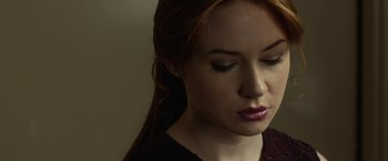 Movie still from “Oculus” (2013), directed by Mike Flanagan – A person with red hair; Close Up shot, Low angle