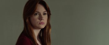 Movie still from “Oculus” (2013), directed by Mike Flanagan – A person with long red hair; Close Up shot, Over the shoulder angle