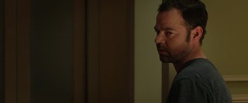 Movie still from “Oculus” (2013), directed by Mike Flanagan – A person looking at the camera; Close Up shot, Over the shoulder angle