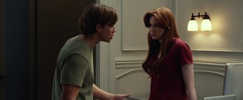 Movie still from “Oculus” (2013), directed by Mike Flanagan – A man and a woman talking to each other; Medium shot, Over the shoulder angle
