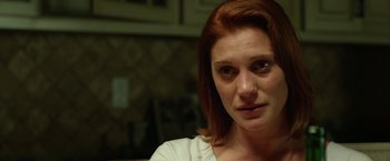 Movie still from “Oculus” (2013), directed by Mike Flanagan – A person with red hair; Close Up shot, Over the shoulder angle