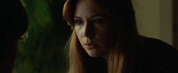 Movie still from “Oculus” (2013), directed by Mike Flanagan – A person with long red hair; Close Up shot, Low angle