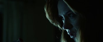 Movie still from “Oculus” (2013), directed by Mike Flanagan – A person with long hair; Close Up shot, Low angle