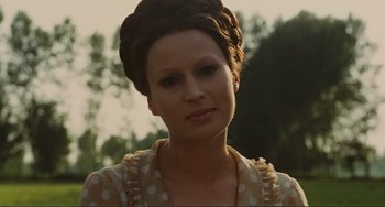 Movie still from “Oedipus Rex” (1967), directed by Pier Paolo Pasolini – A person wearing a polka dot dress; Close Up shot, Over the shoulder angle