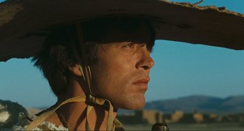 Movie still from “Oedipus Rex” (1967), directed by Pier Paolo Pasolini – A person wearing a cowboy hat; Close Up shot, Low angle