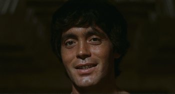 Movie still from “Oedipus Rex” (1967), directed by Pier Paolo Pasolini – A man's face in a dark room; Close Up shot, Low angle