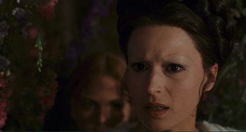 Movie still from “Oedipus Rex” (1967), directed by Pier Paolo Pasolini – A woman's face in a dark room; Close Up shot, Over the shoulder angle