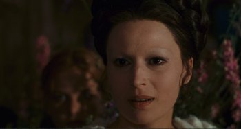 Movie still from “Oedipus Rex” (1967), directed by Pier Paolo Pasolini – A woman's face in a dark room; Close Up shot, Over the shoulder angle