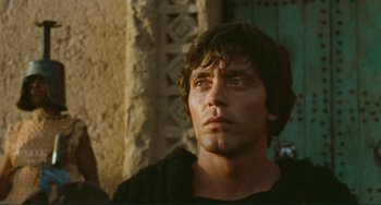 Movie still from “Oedipus Rex” (1967), directed by Pier Paolo Pasolini – A person looking up at the sky; Close Up shot, Low angle