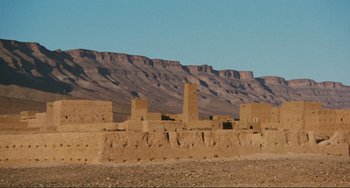 Movie still from “Oedipus Rex” (1967), directed by Pier Paolo Pasolini – A desert landscape with mountains in the background; Extreme Wide shot, Low angle